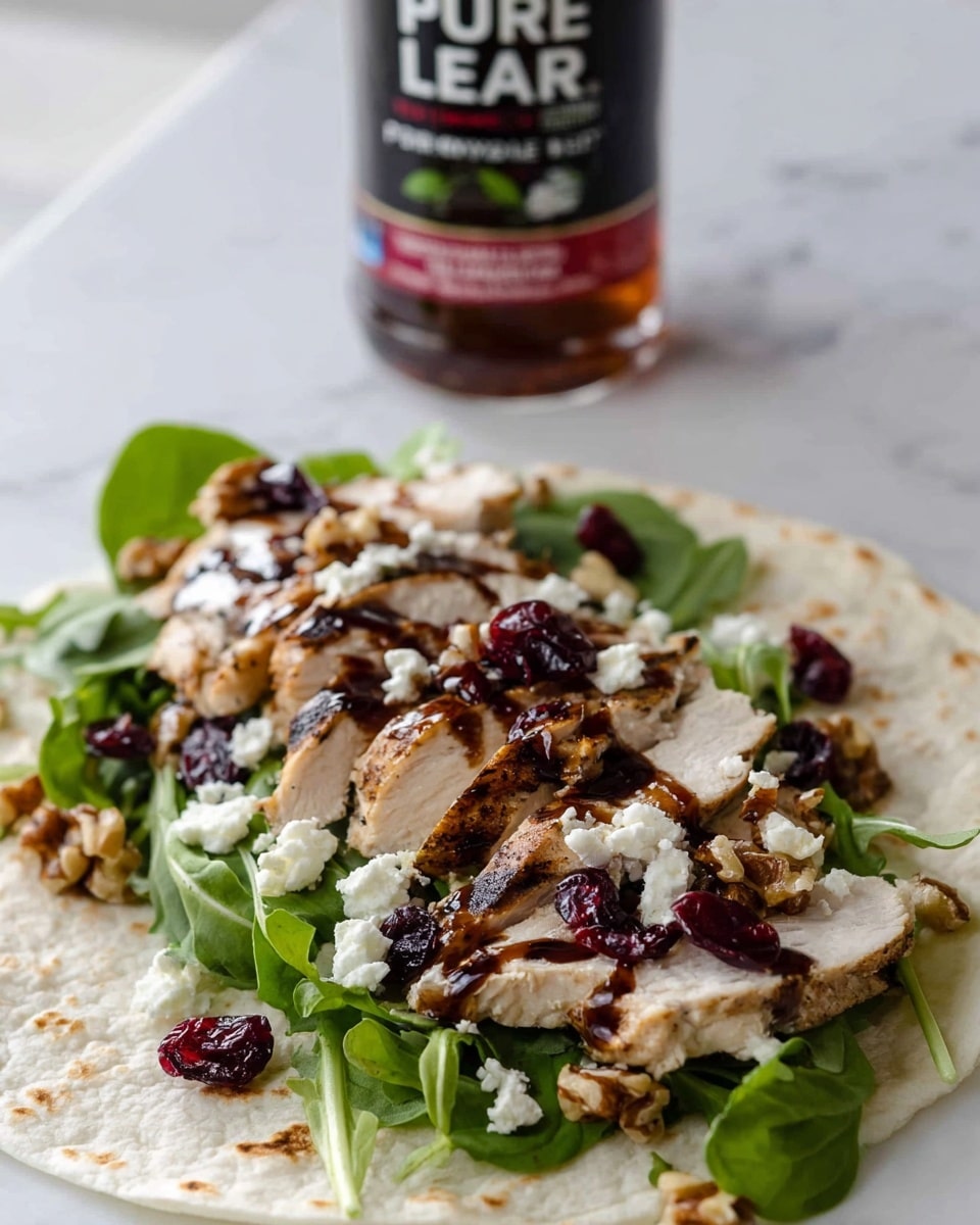 A soft white tortilla lies flat on a white marbled surface, layered with fresh green arugula at the bottom, topped with several slices of grilled chicken breast drizzled with dark balsamic glaze, scattered white crumbled goat cheese, small dark red dried cranberries, and chopped light brown walnuts sprinkled all over. In the background, a bottle of Pure Leaf Raspberry iced tea is visible. photo taken with an iphone --ar 4:5 --v 7