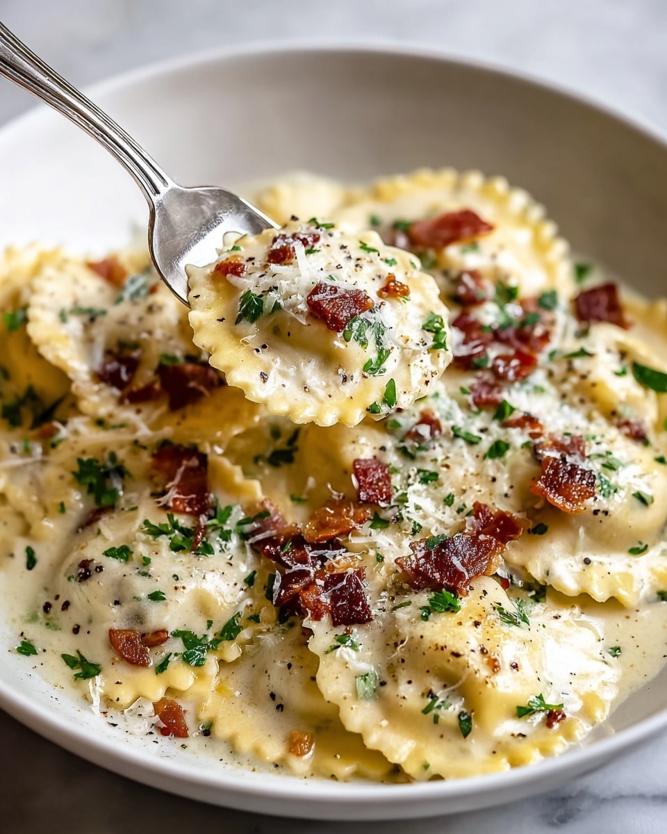 A white shallow bowl filled with round ravioli pasta covered in creamy white sauce. The ravioli noodles are pale yellow with a crimped edge, stacked in layers that show their soft texture. On top, small pieces of crispy dark brown bacon and finely chopped fresh green herbs are spread evenly. Grated white cheese and visible black pepper flakes are sprinkled over the dish. A silver fork lifts a portion of ravioli, showing clusters of sauce, bacon, herbs, and cheese clinging to it. The bowl sits on a white marbled surface, adding brightness to the warm tones of the food. photo taken with an iphone --ar 4:5 --v 7