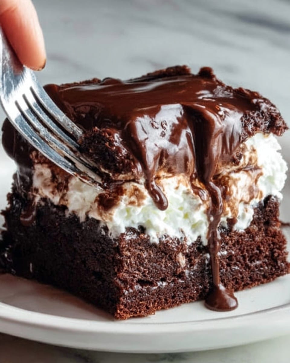 The image shows a close-up of a rich chocolate brownie on a white plate, with three visible layers. The bottom layer is a dense, dark brown brownie with a slightly crumbly texture. Above it is a thick, smooth white cream layer that looks fluffy and soft. On top, there is a thick, glossy layer of dark chocolate sauce that drips slightly over the cream and brownie. The background is a white marbled surface. Photo taken with an iphone --ar 4:5 --v 7