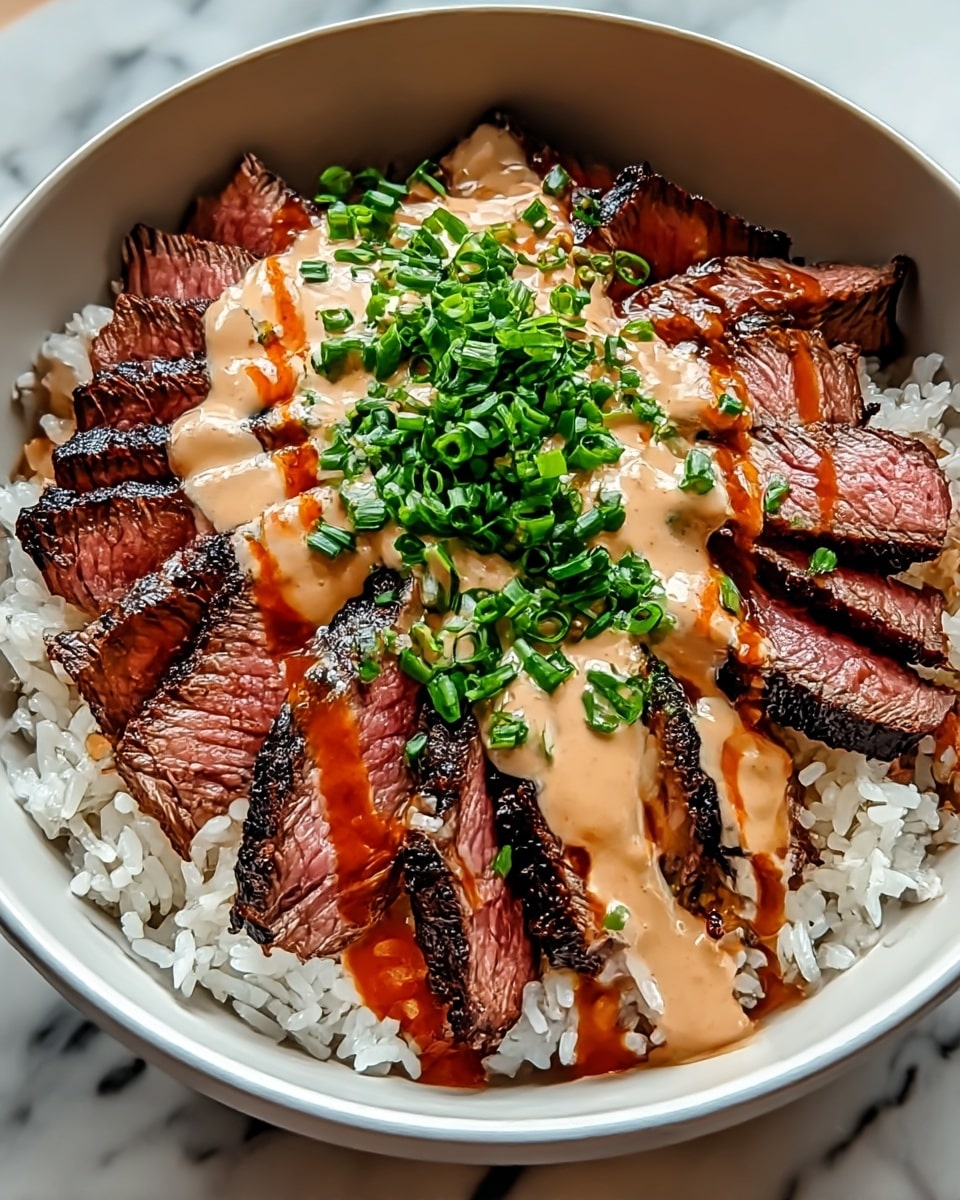 A white bowl filled with three main layers: the bottom layer is fluffy white rice with visible grains, the middle layer consists of medium-rare grilled steak slices with dark char marks and a pink center, neatly arranged all around, and the top layer is creamy beige sauce drizzled with a reddish-brown sauce, garnished with finely chopped bright green chives in the center. The bowl is placed on a white marbled surface. photo taken with an iphone --ar 4:5 --v 7